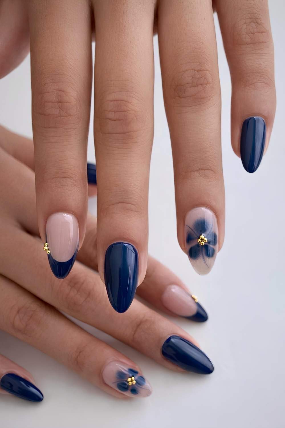 Dark blue nails with florals and gold beads