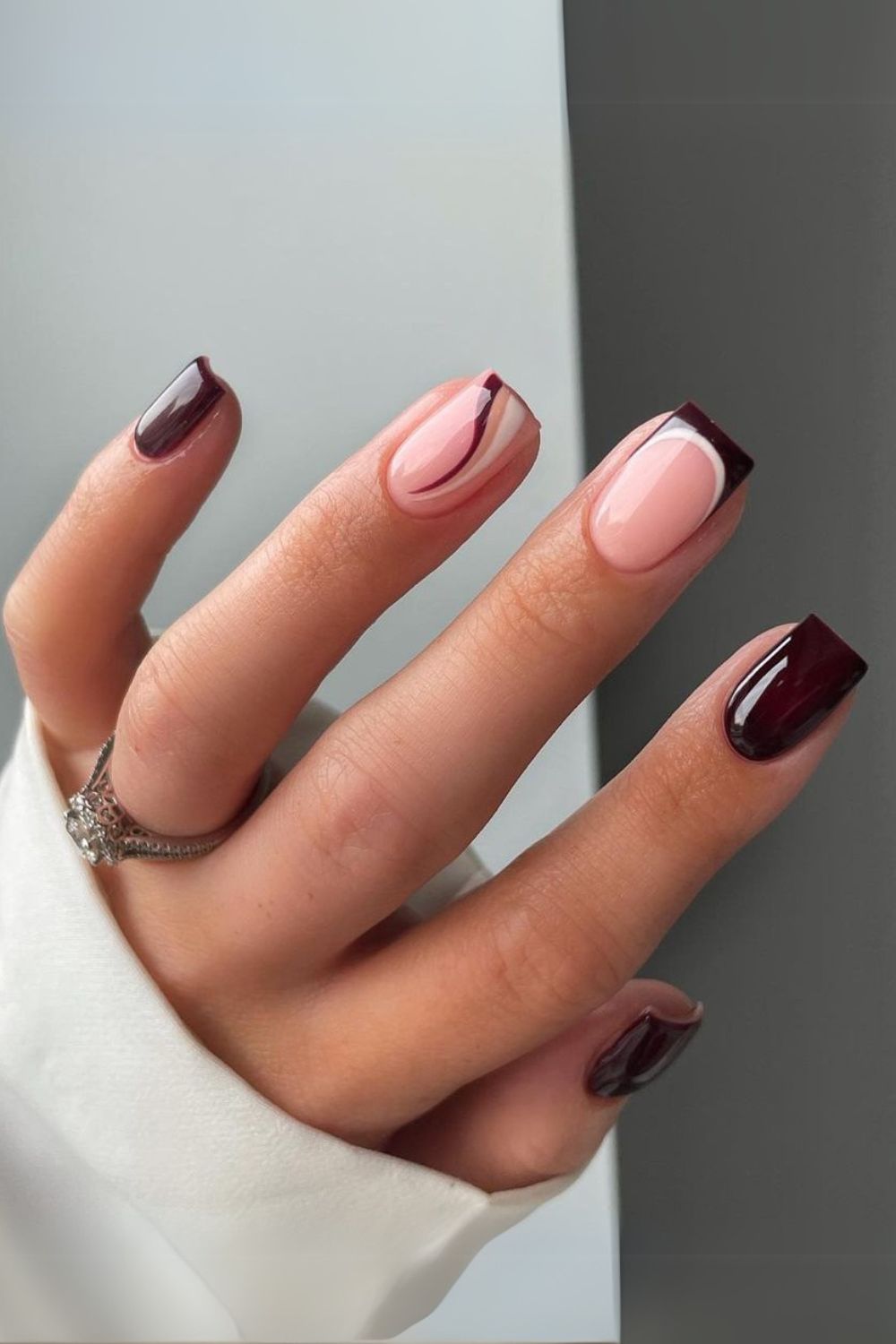 Dark brown nails with white accents