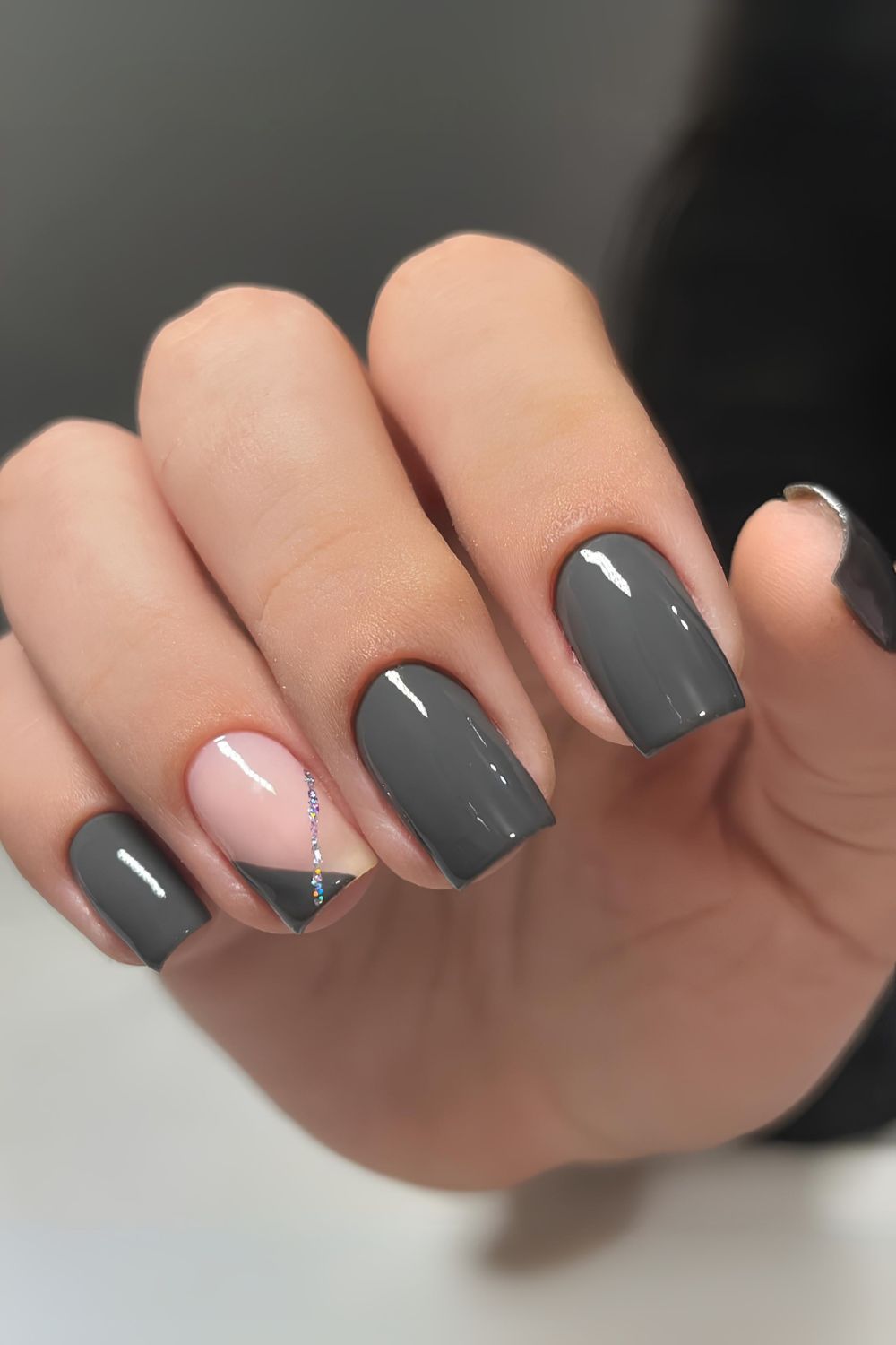 Dark gray nails with glitter stripe