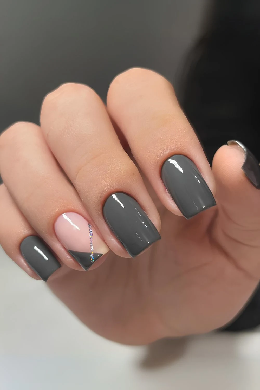 Dark gray nails with glitter stripe