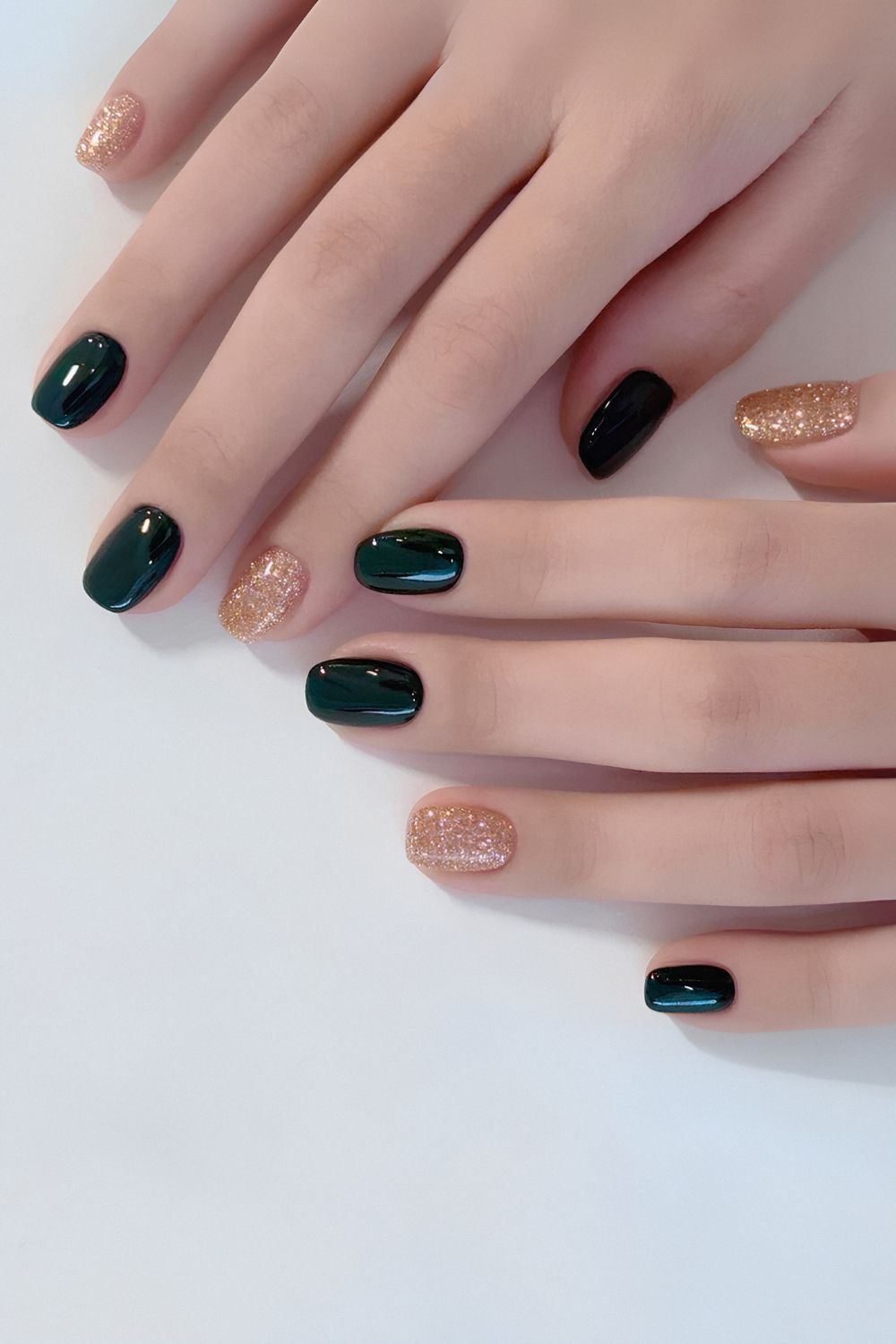 Dark green mani with gold accent nails