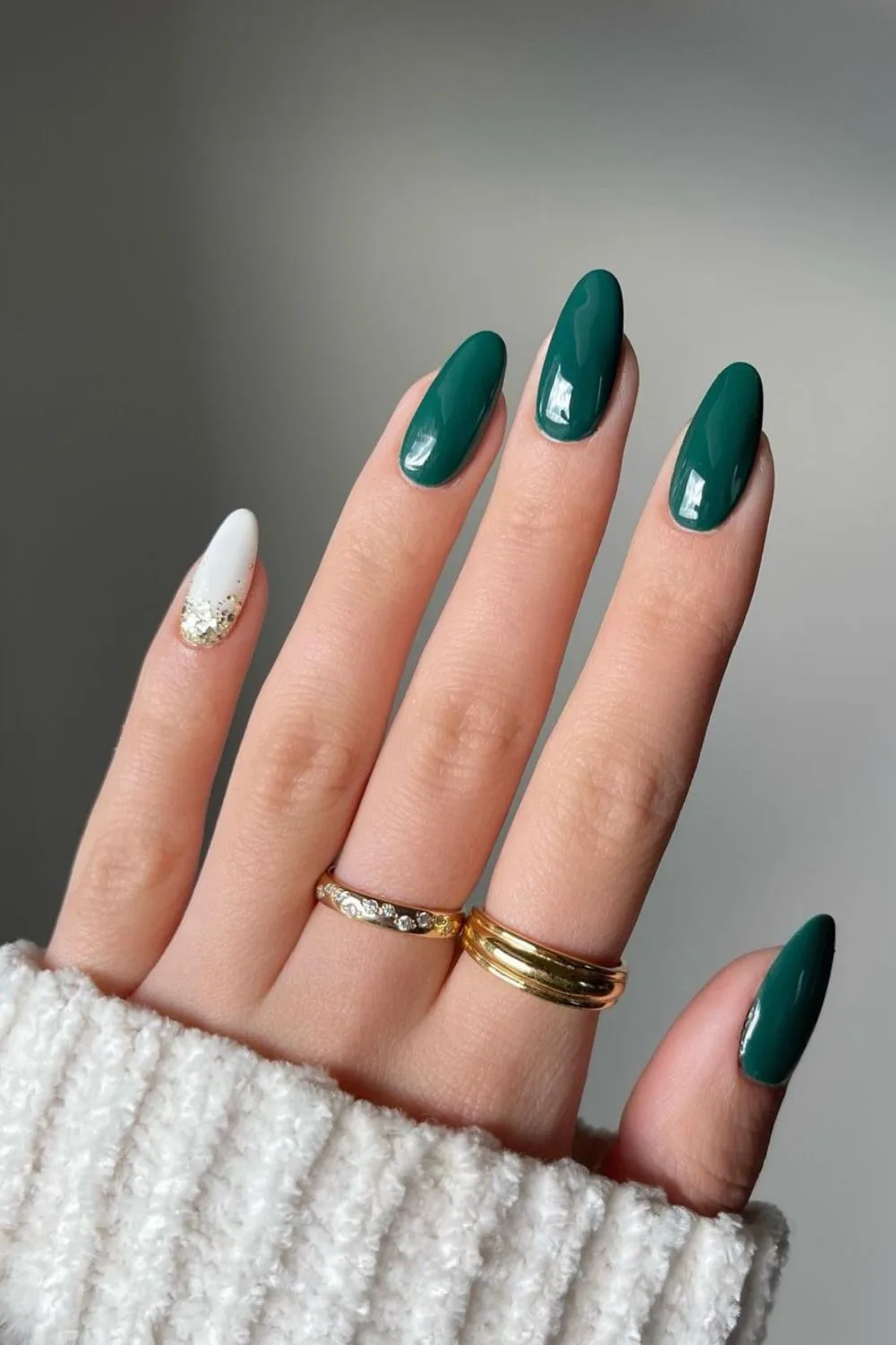 Dark green mani with white accent nail