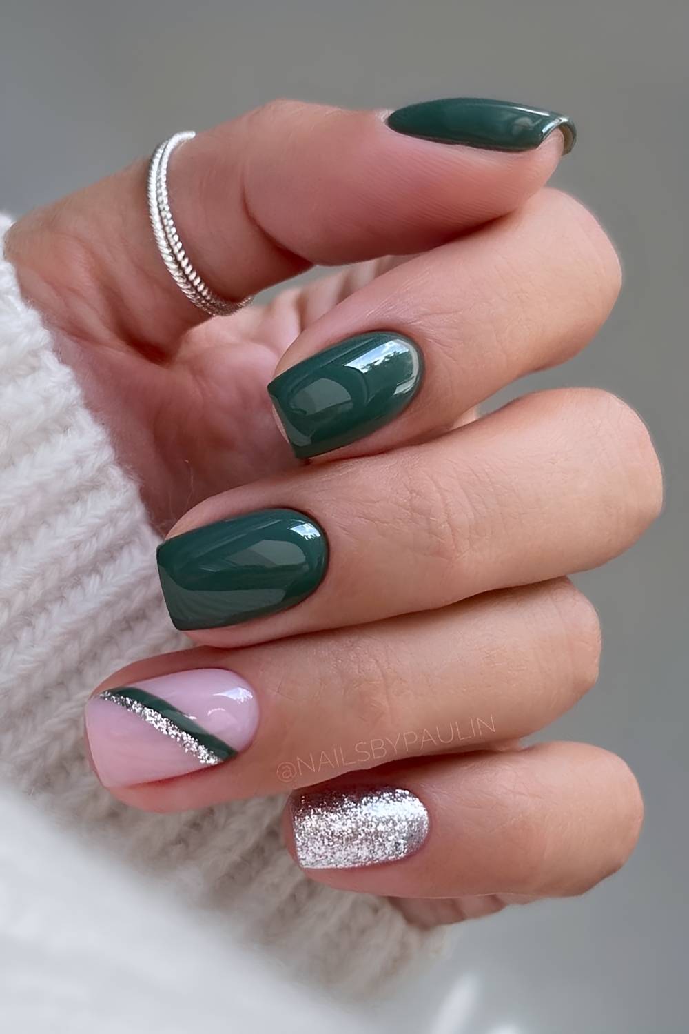 Dark green nails with accent silver glitter