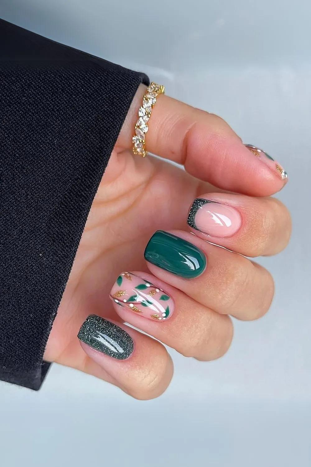 Dark green nails with holiday accents