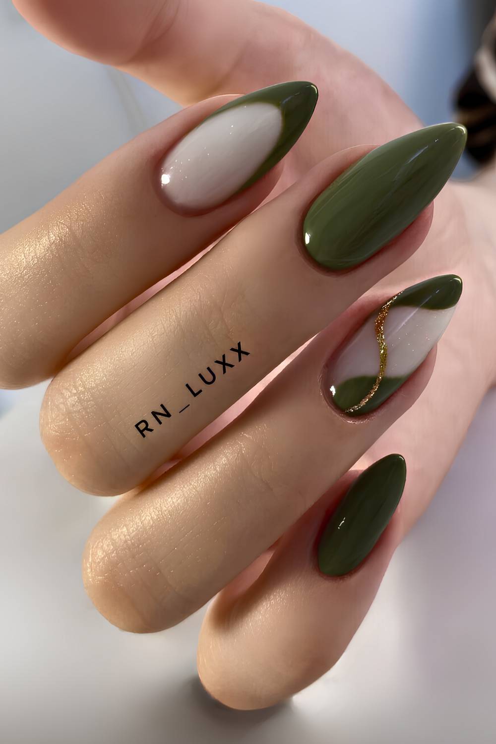 Dark olive and white mani with gold glitter