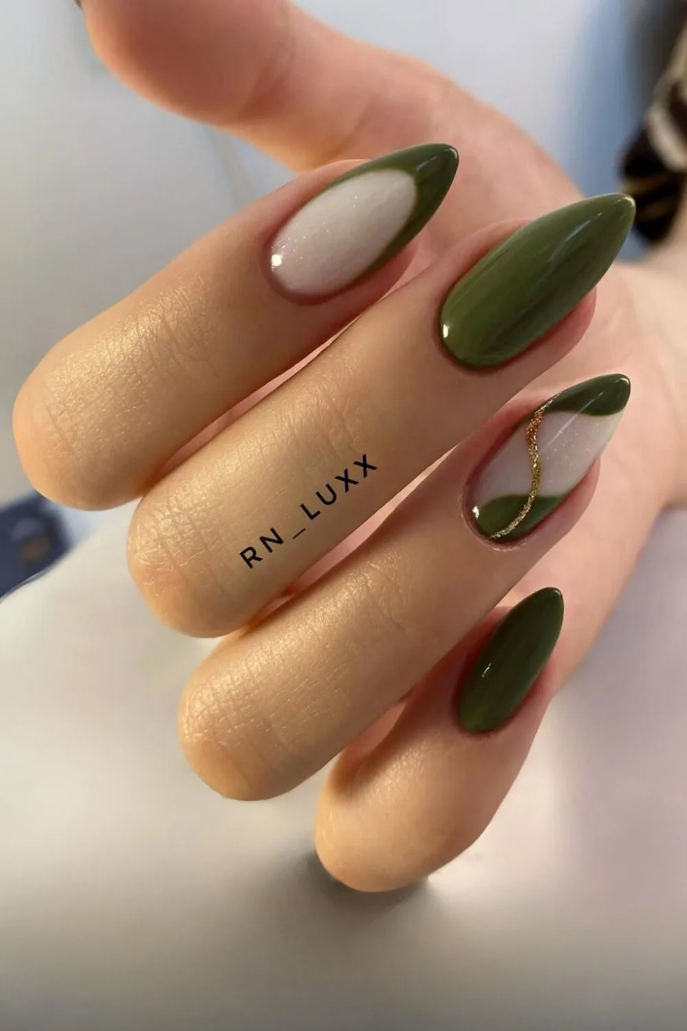 https://thepinkissue.com/wp-content/uploads/2024/11/Dark-olive-nails-with-white-and-gold-accents.jpg.webp?utm_source=chatgpt.com