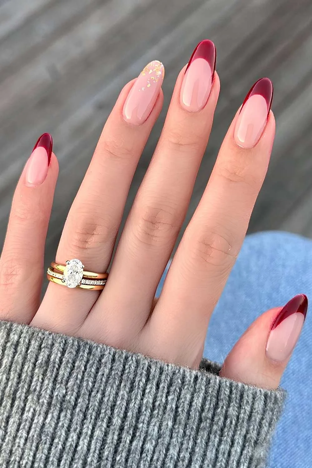 Dark red French nails with gold foil details