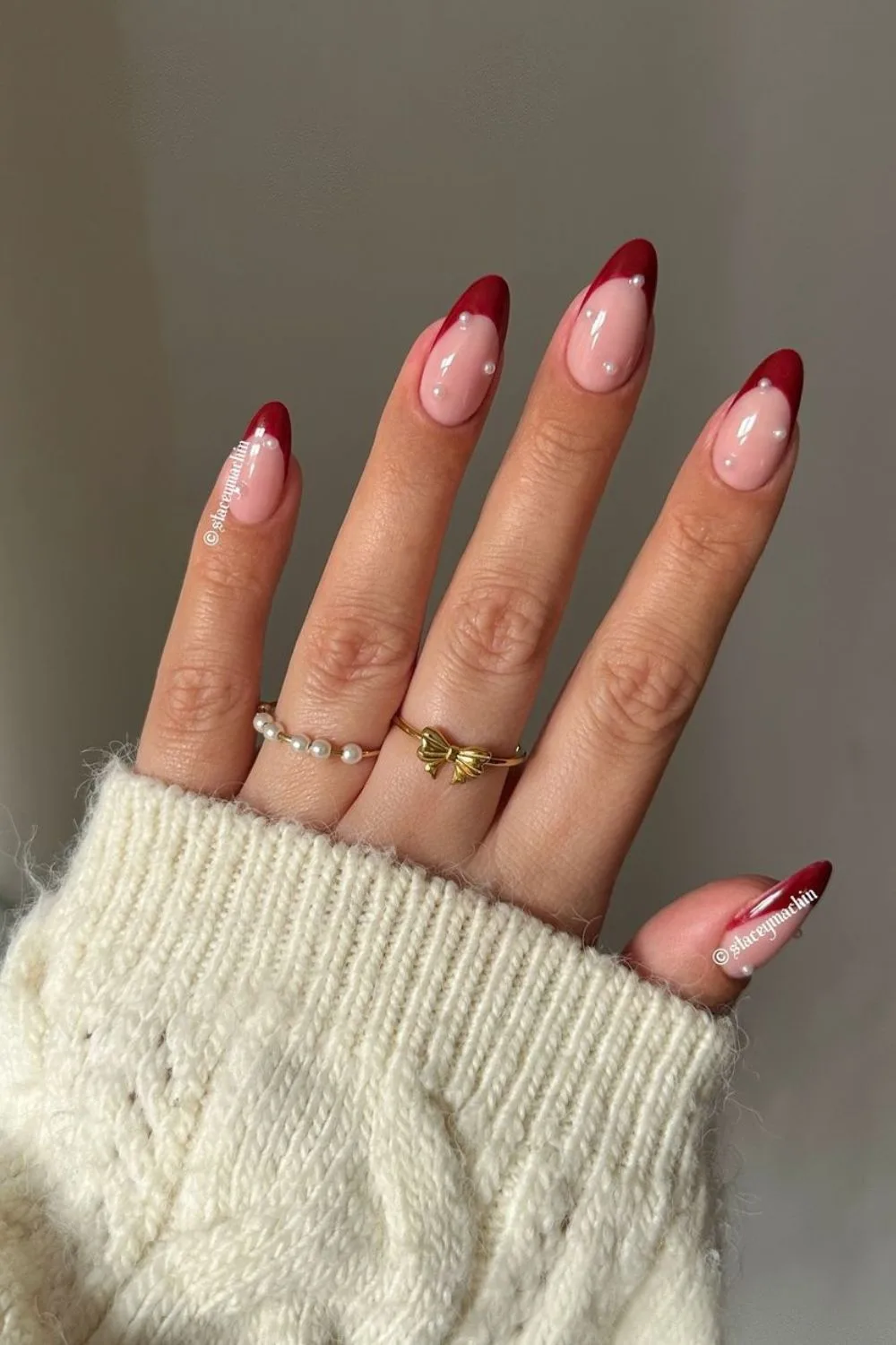 Dark red French nails with pearls