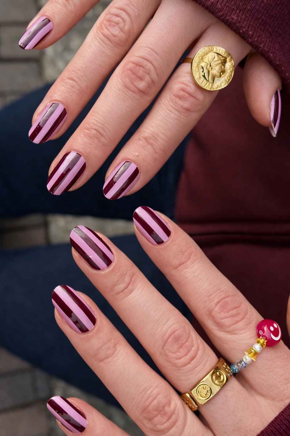 Dark red and pink striped nails