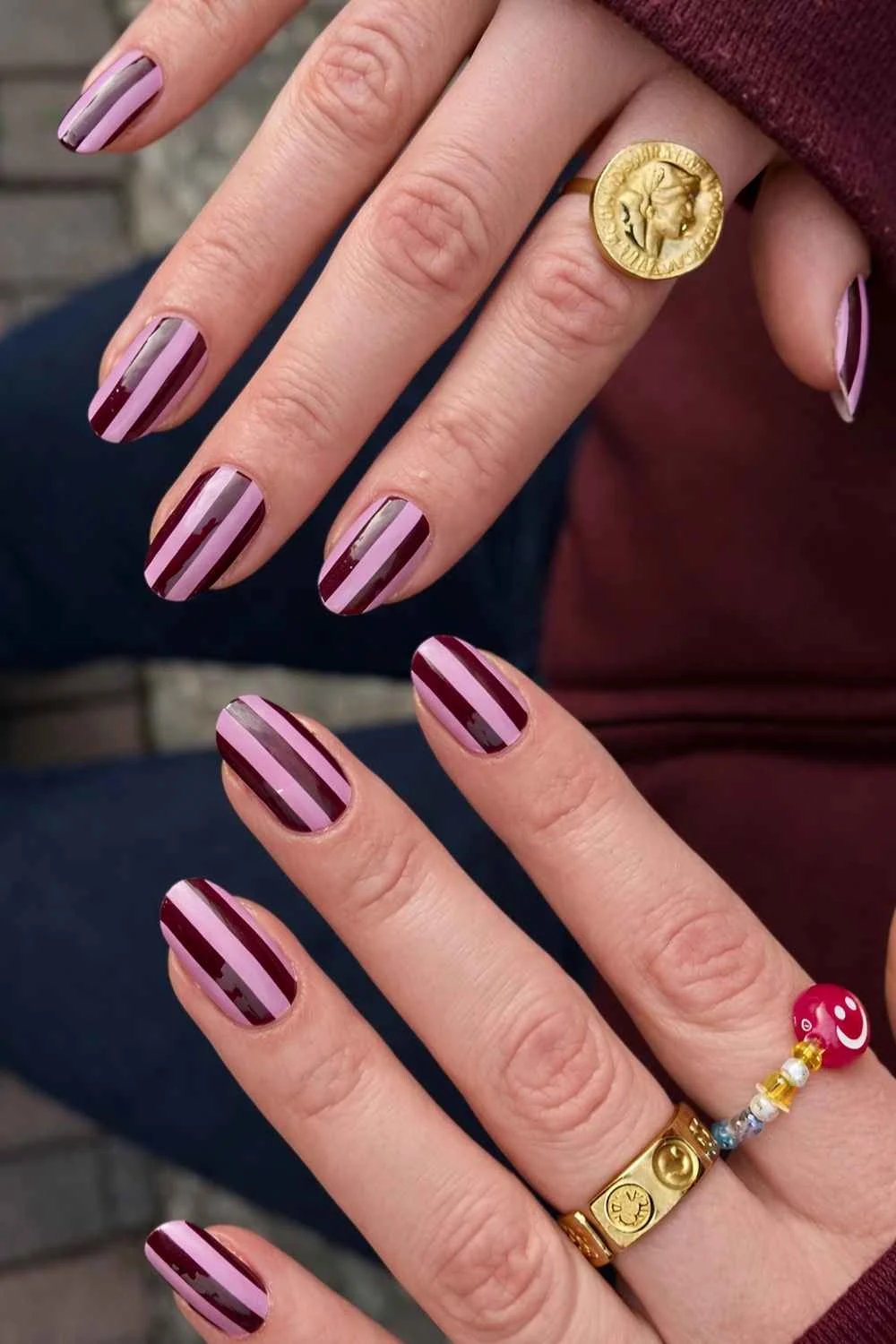 Dark red and pink striped nails