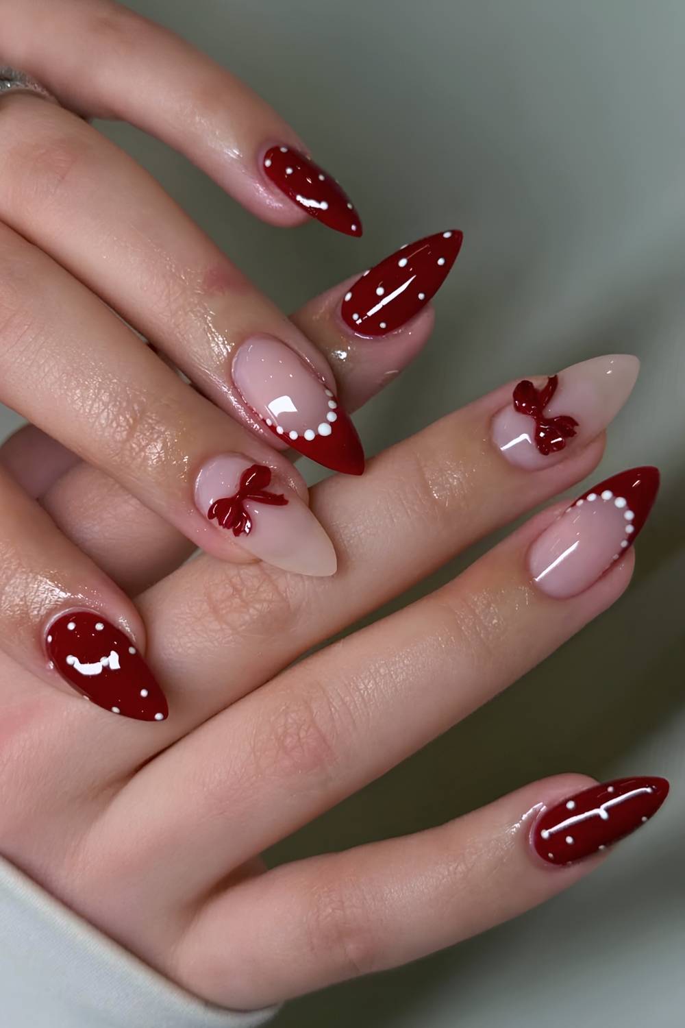 Dark red and white coquette manicure