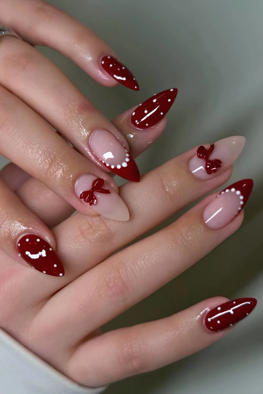 Dark red and white coquette manicure