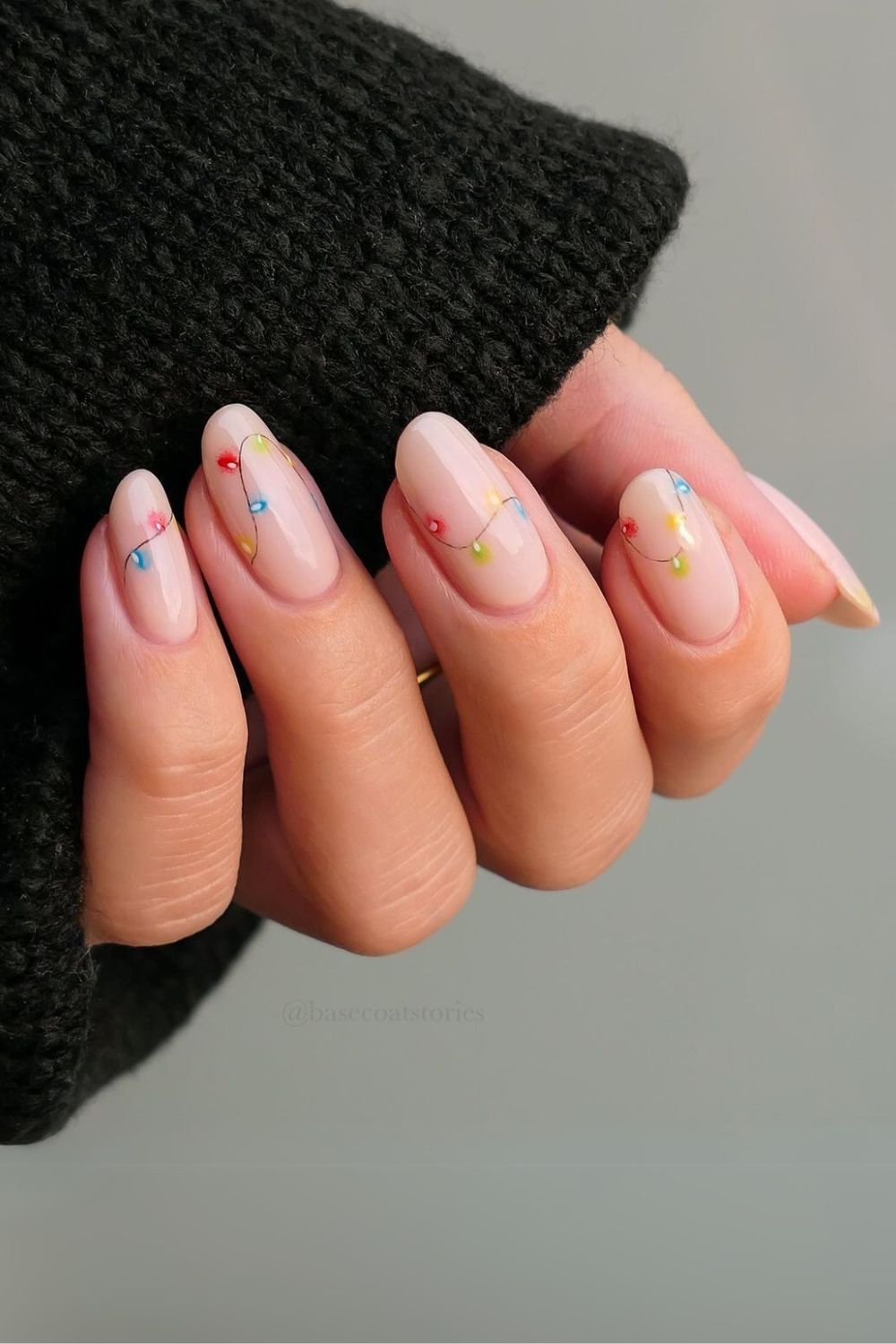 Fairy light nails on a nude nail base