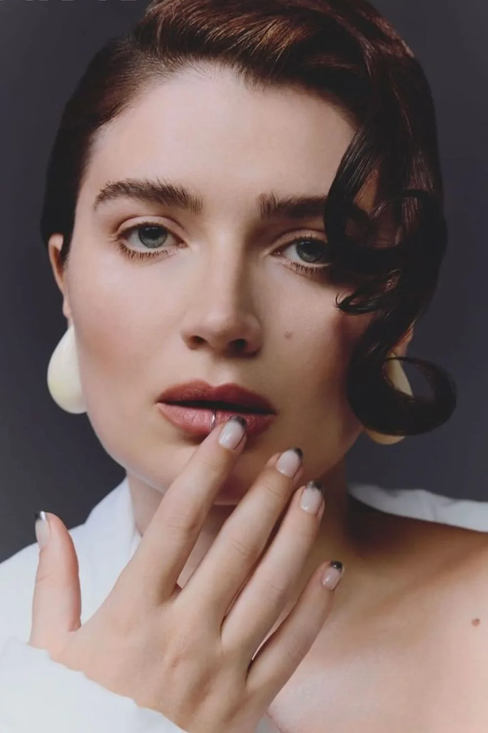 Famous actress posing with faded chrome french tip nails