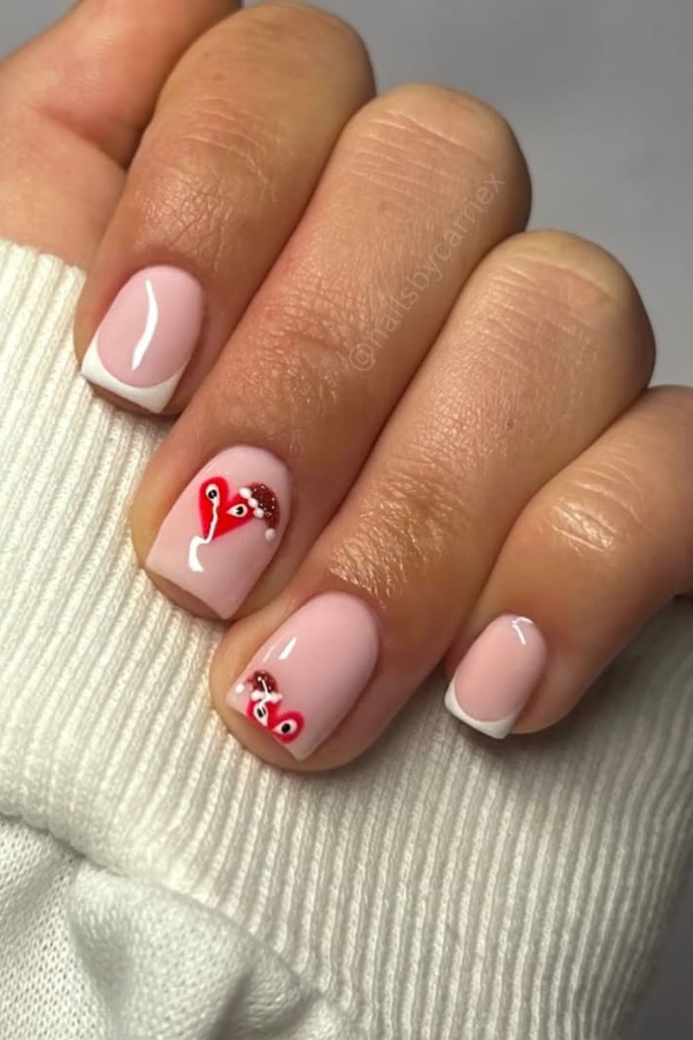 French tip nails with Christmas love bugs accent