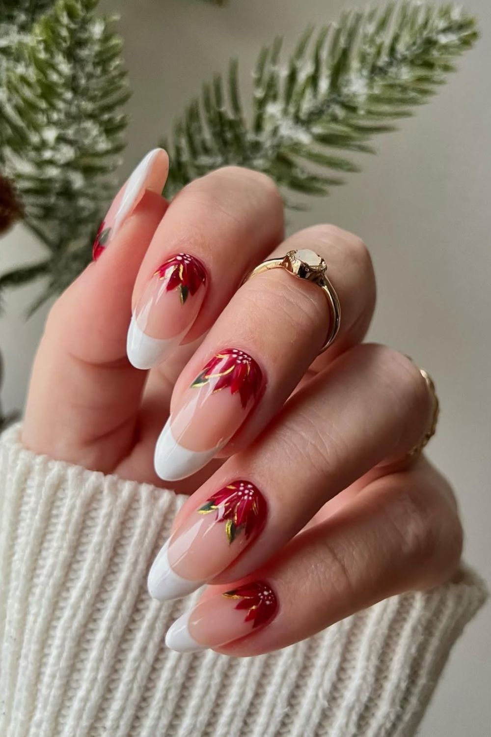 French tip nails with poinsettia flowers accent