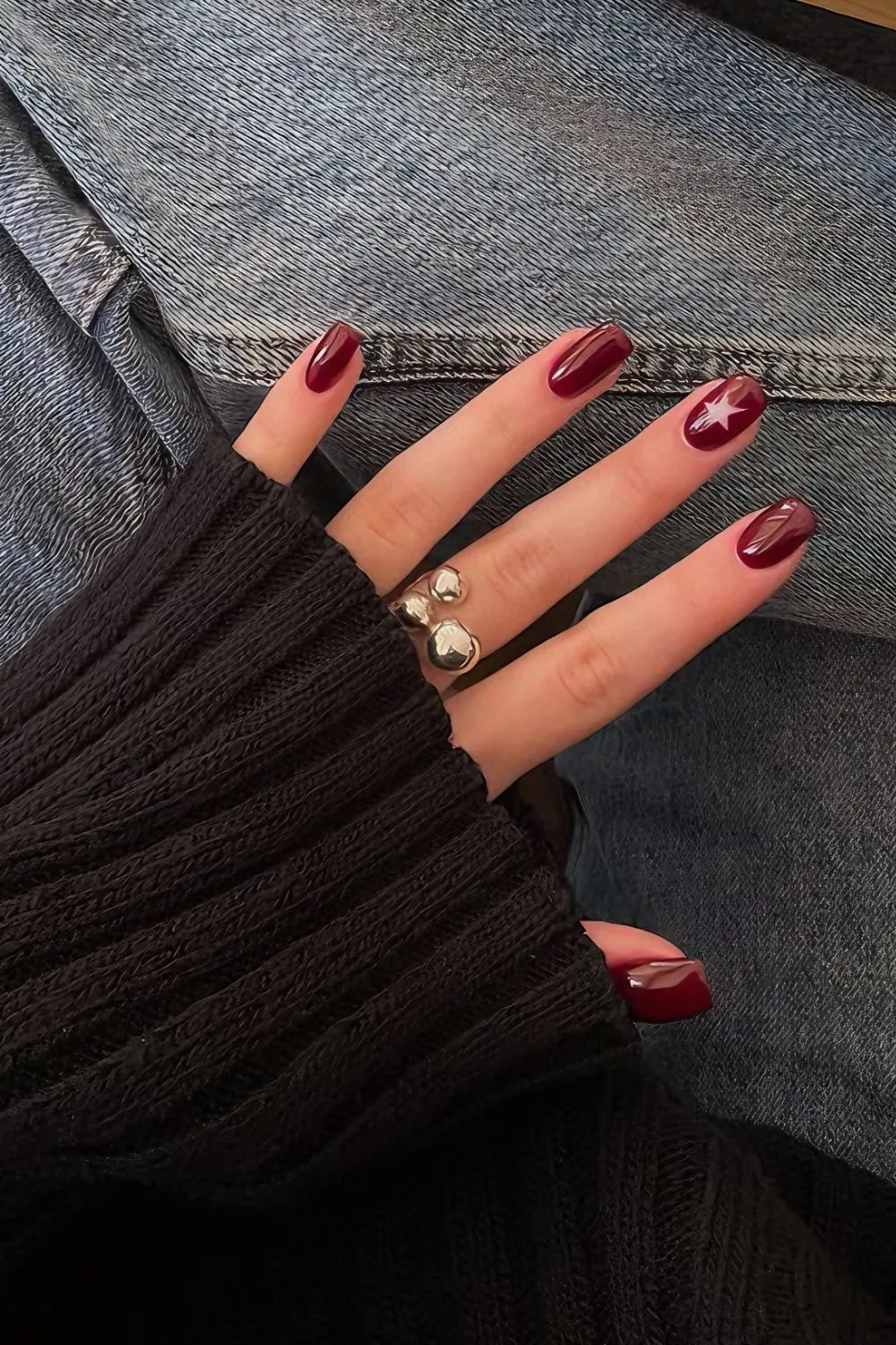 Garnet red nails with star cutout accent