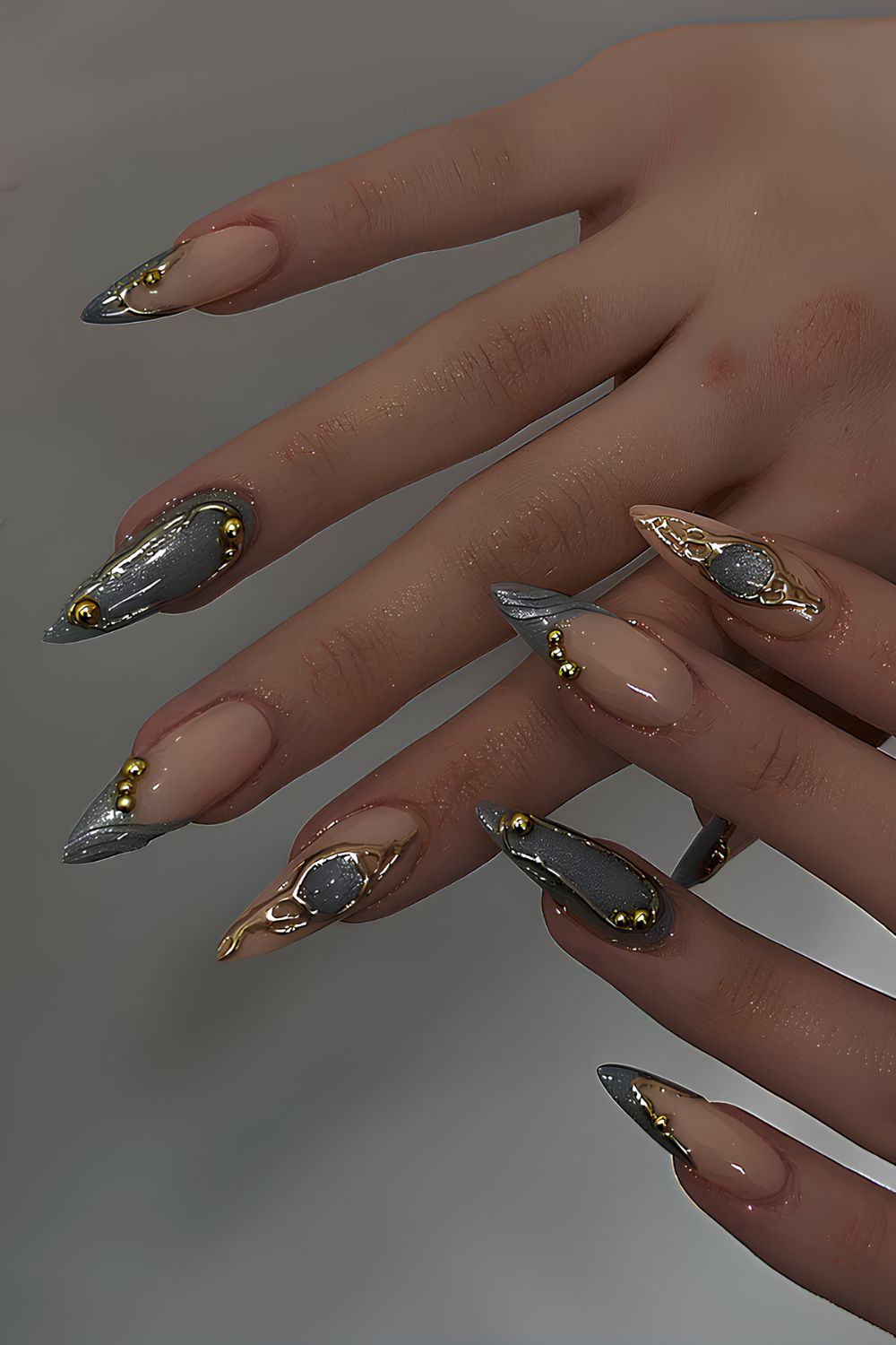 Glittery gray nails with gold accents