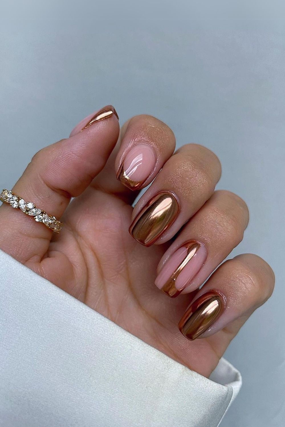 Gold chrome nails with negative space design