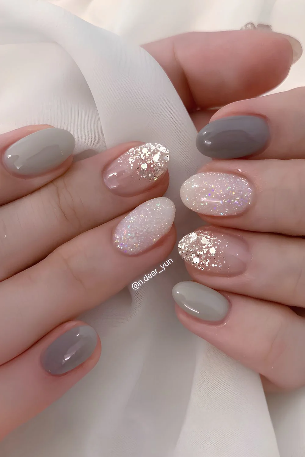 Gray manicure with accent glitter