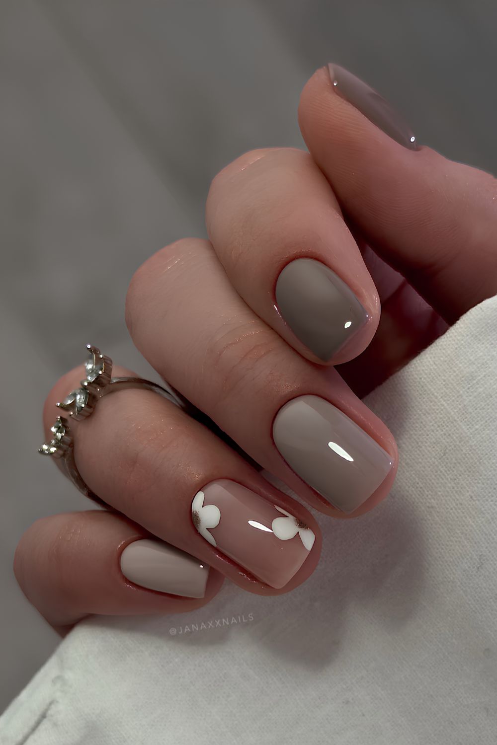 Gray nails with white floral art