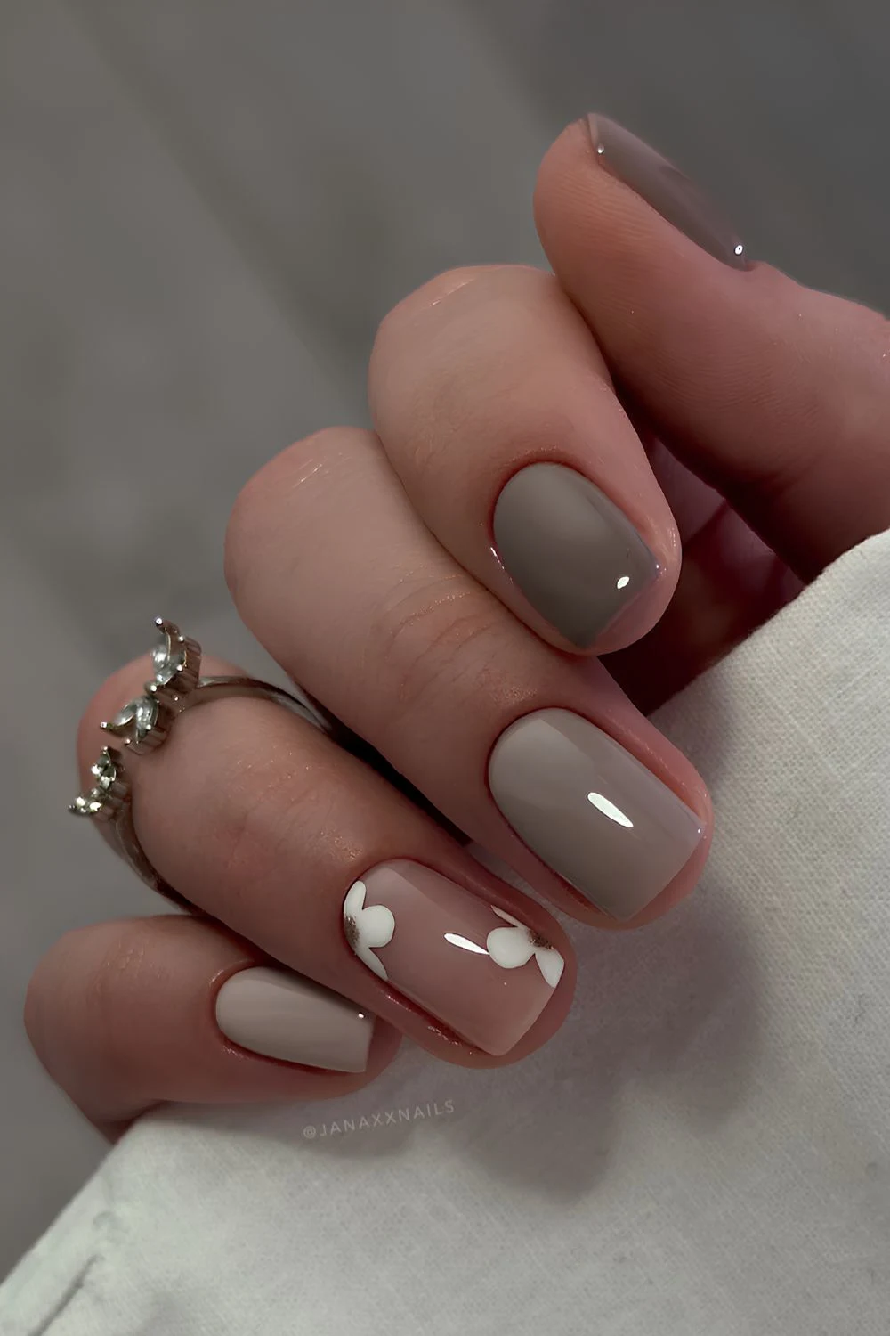 Gray nails with white floral art