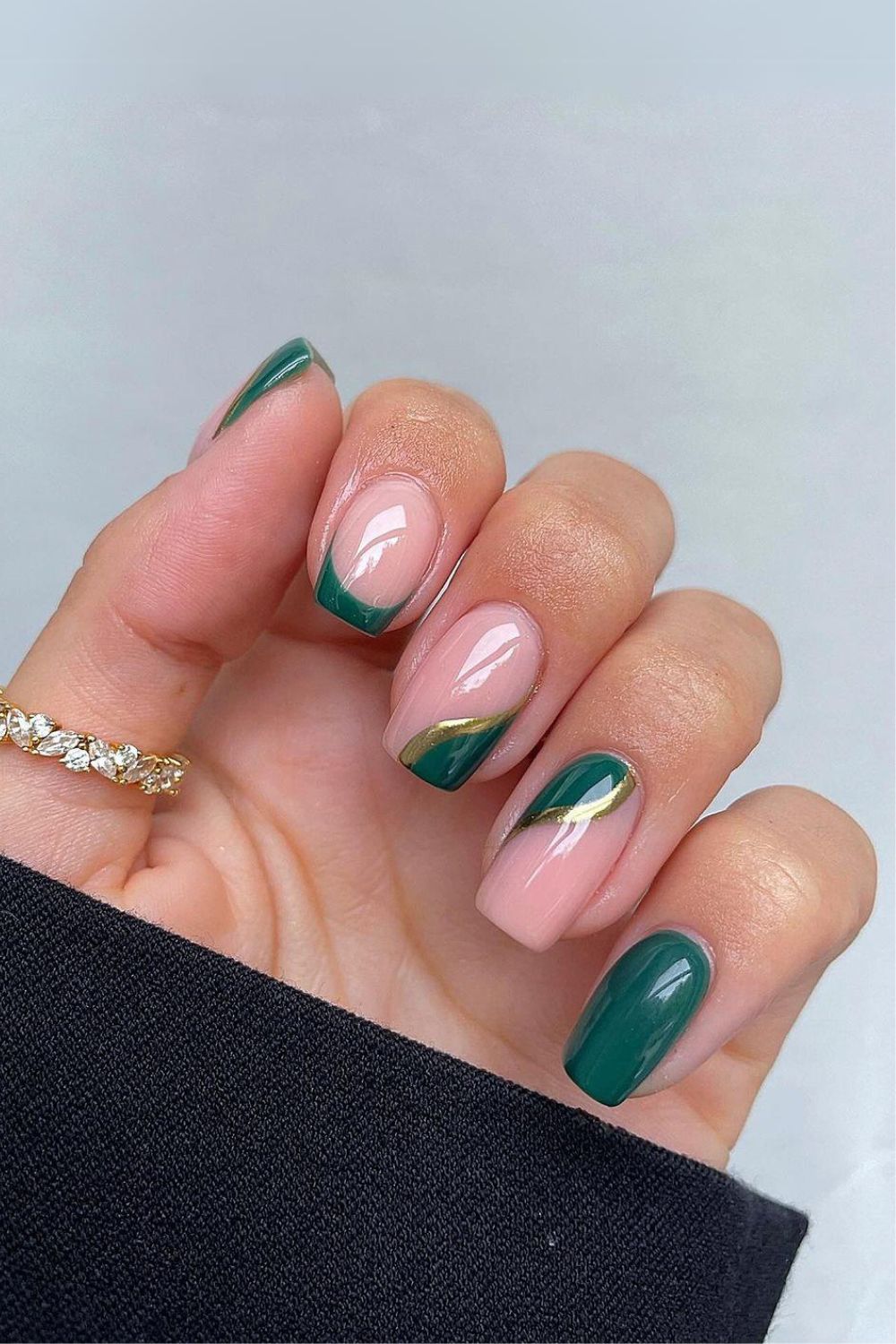 Green nails with side tip and gold accents