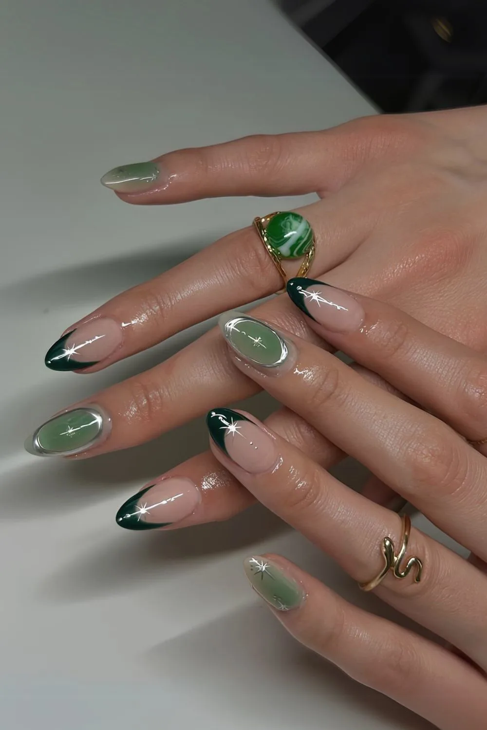 Jade green nails with celestial accents