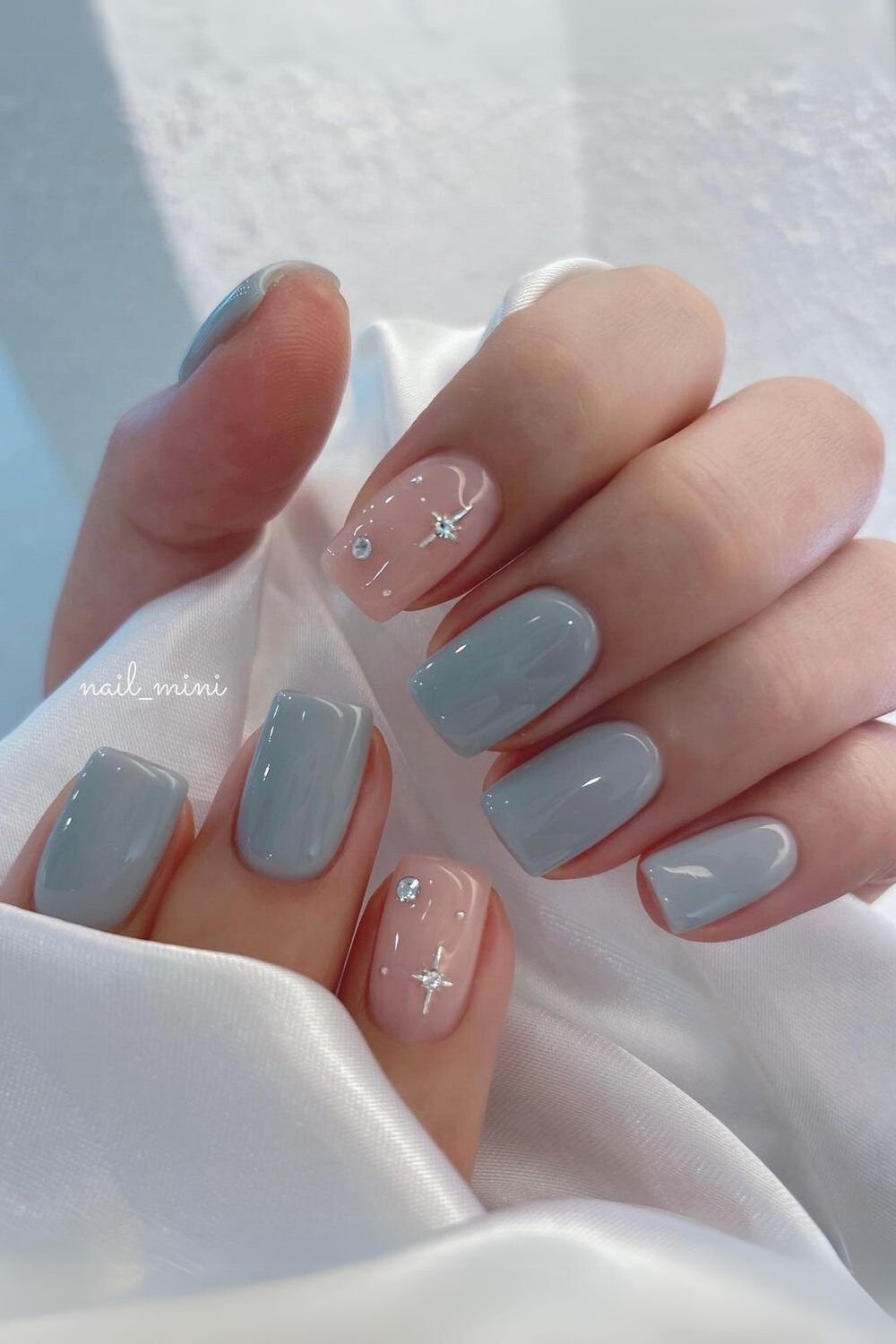 Light blue nails with rhinestones