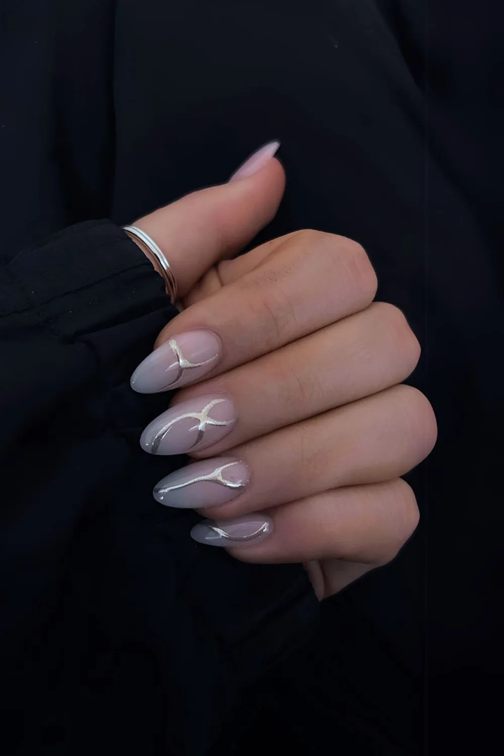 Light blue ombre nails with silver chrome swirls