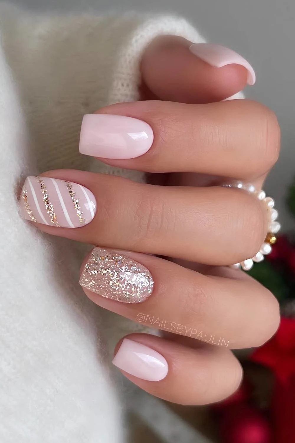 Light pink christmas nails with gold glitter