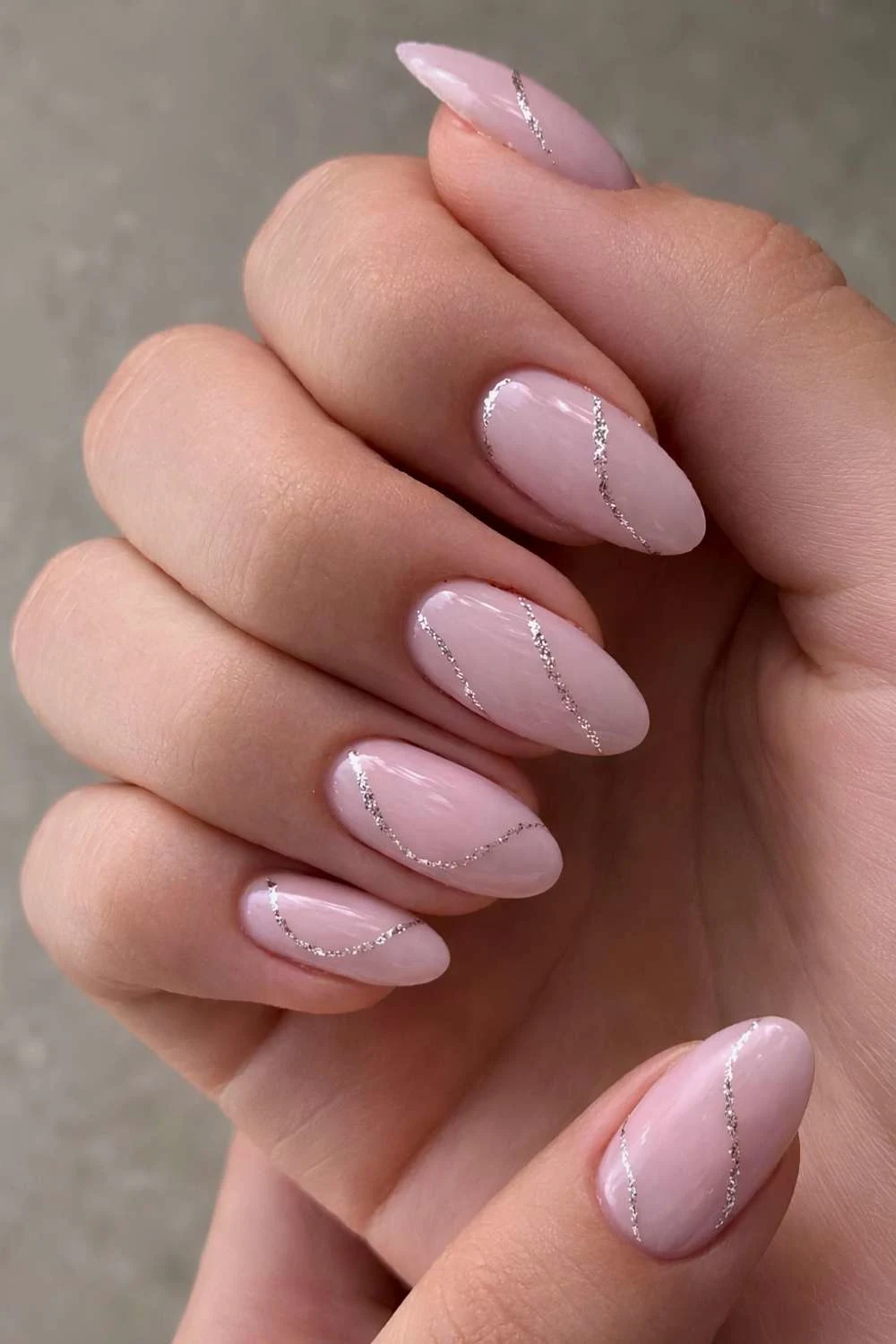Light pink nails with silver glitter line work