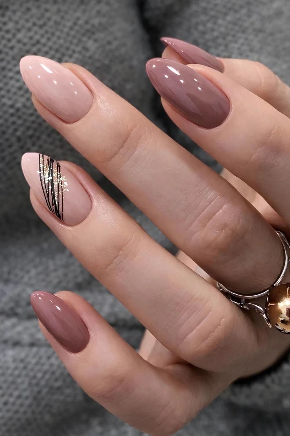 Mauve nails with line art and glitter