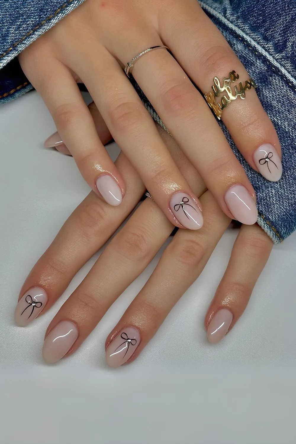 Milky nails with bow accents