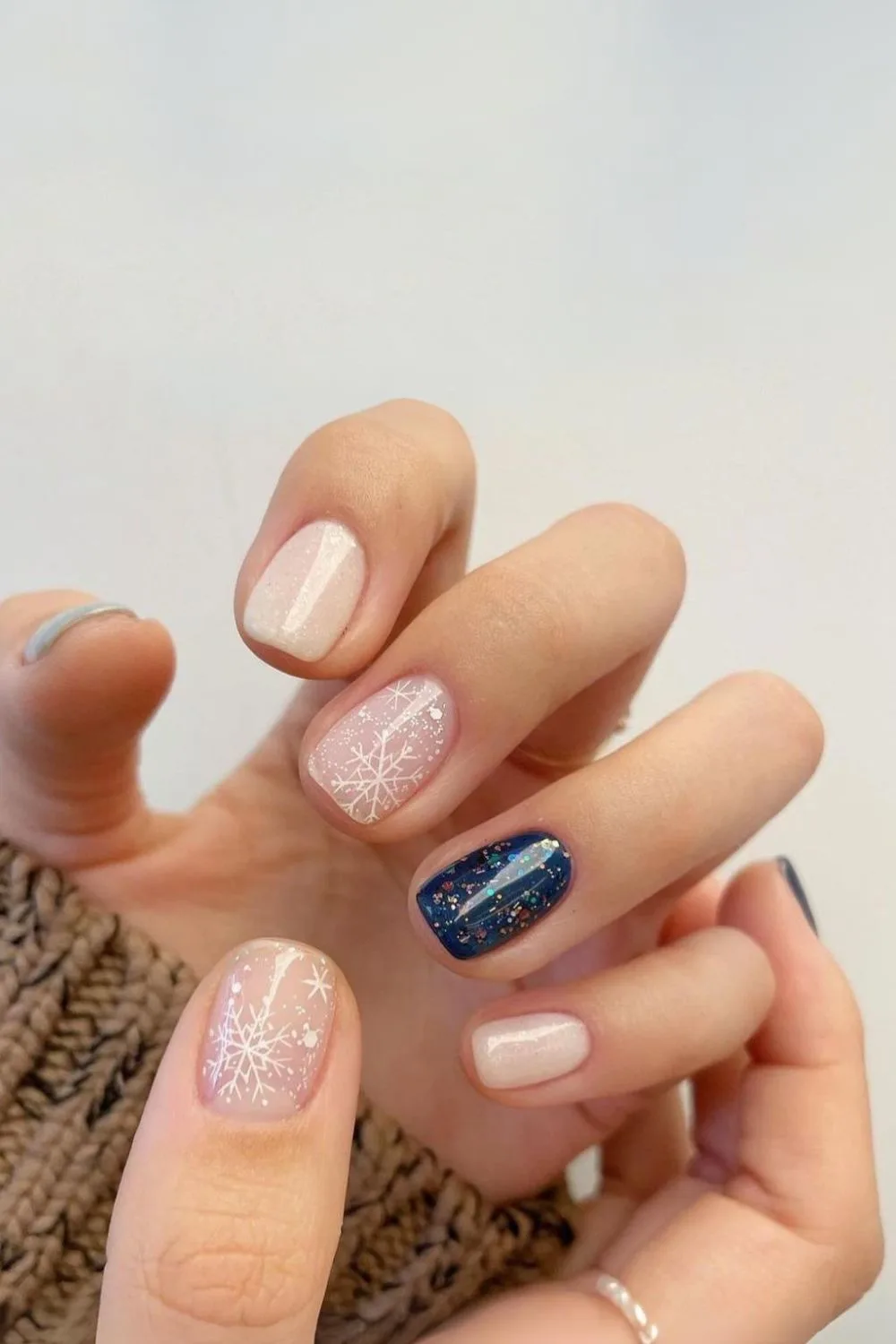 Milky nails with snowflake and navy glitter