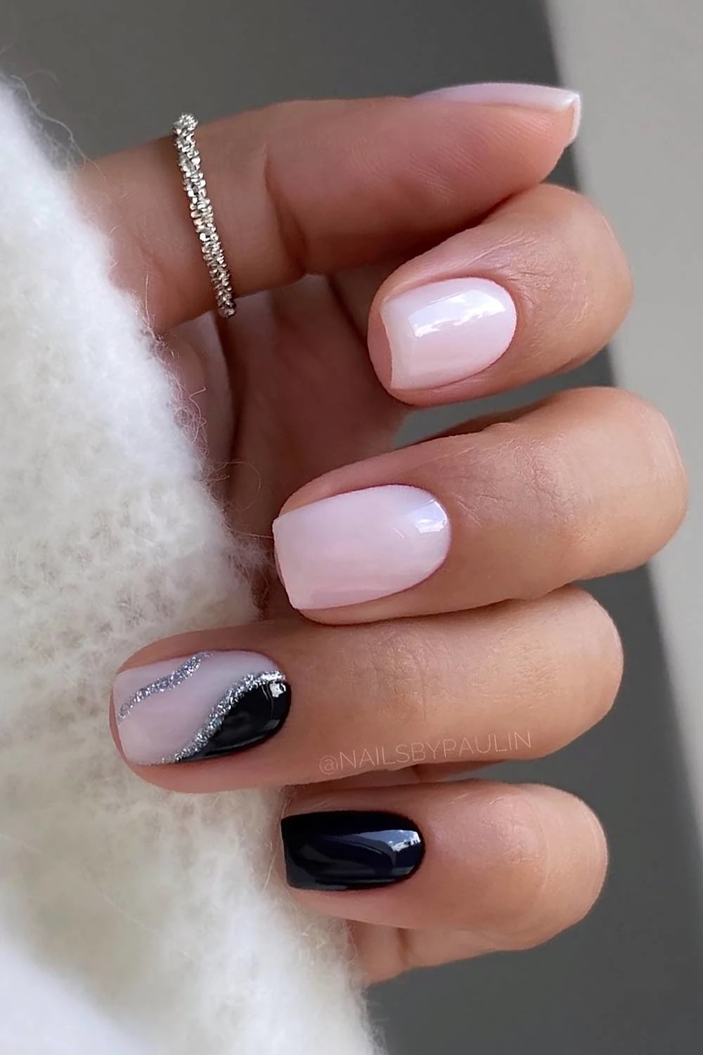 Milky white and black nails with silver glitter