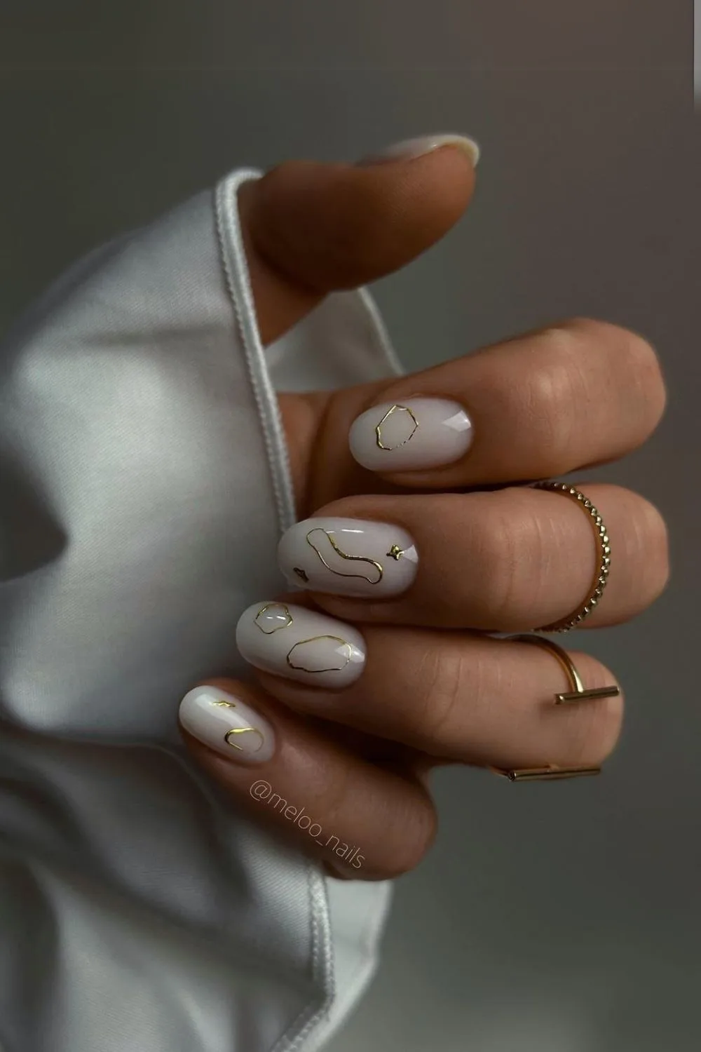 Milky white nails with 3d chrome accents