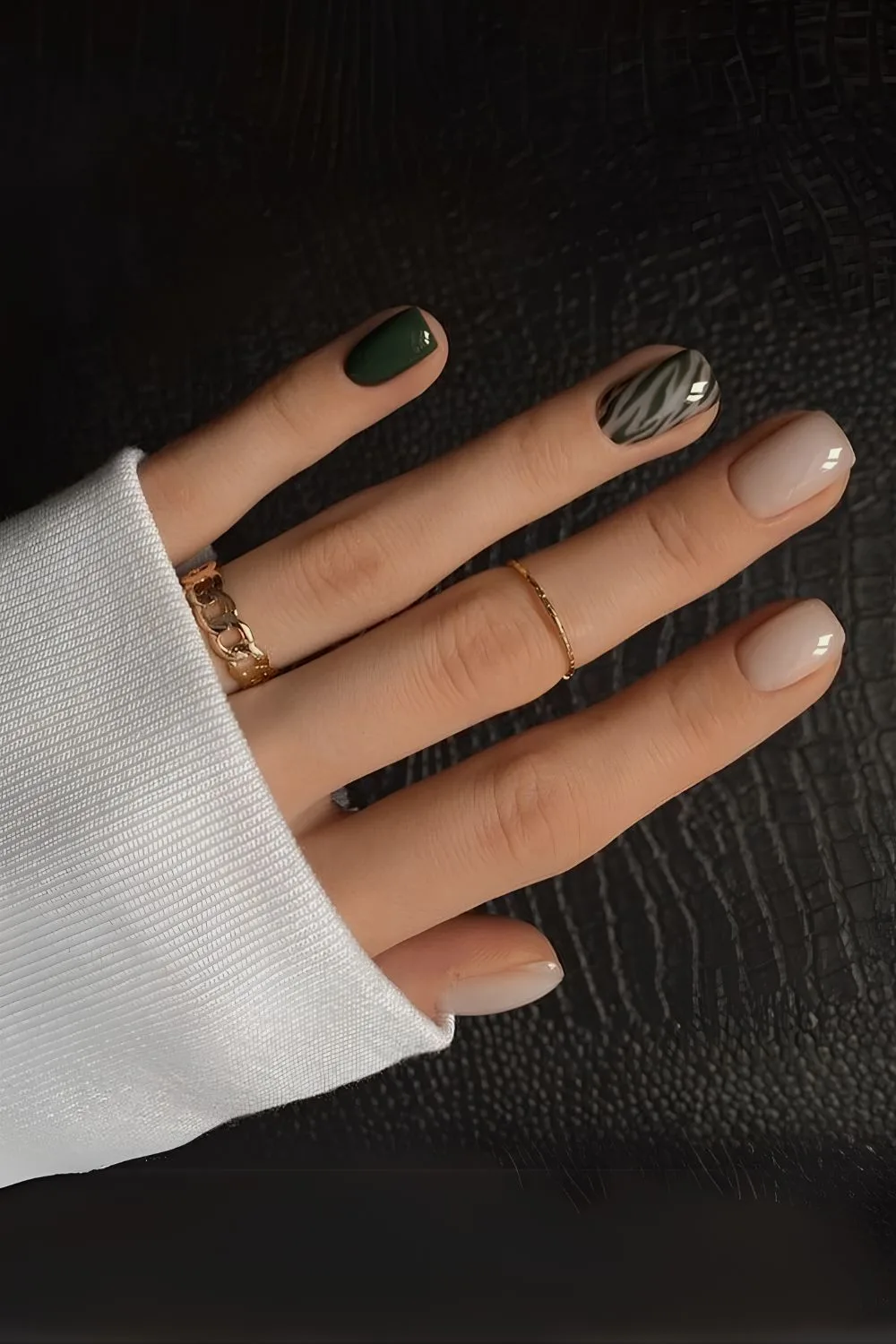 Moody green and neutral nails with zebra print