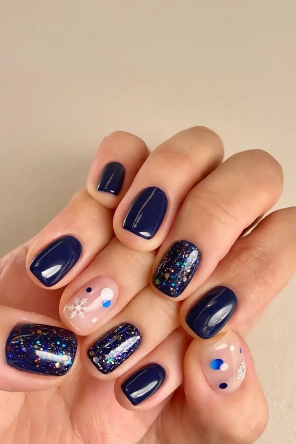 Navy blue nails with glitter and snowflakes