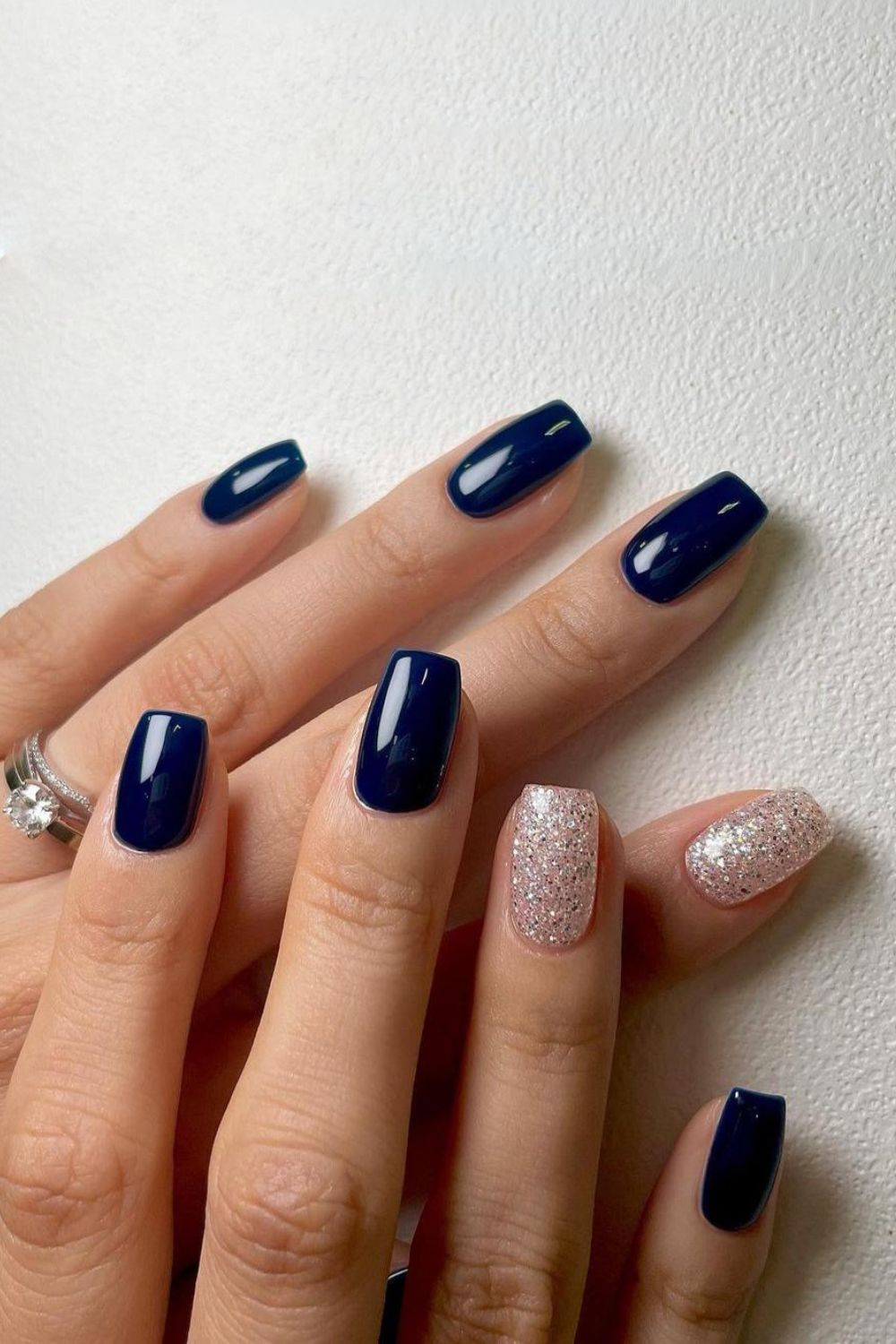 Navy mani with glitter accent nails