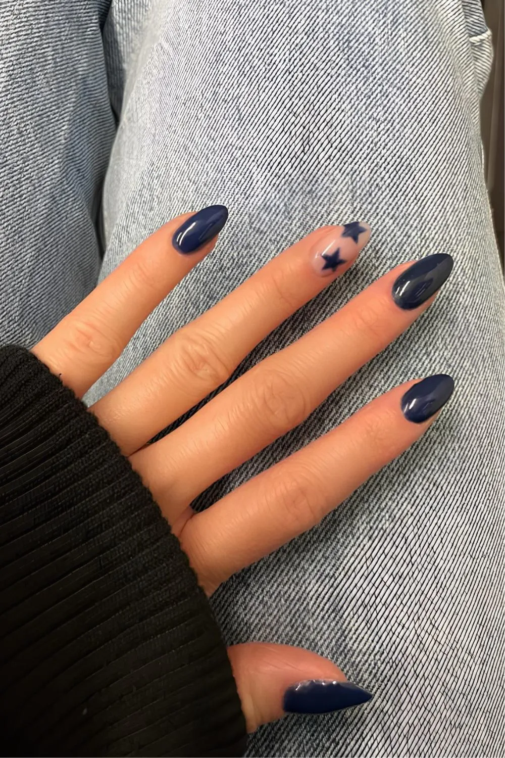 Navy manicure with star accents