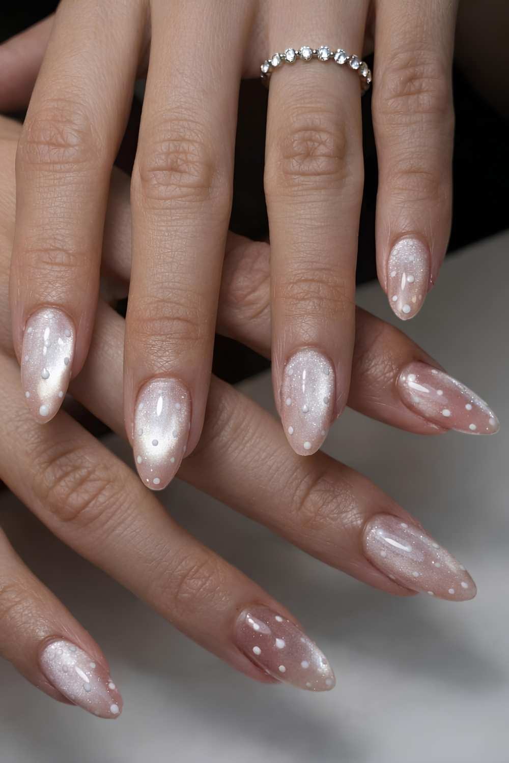 Neutral cat eye nails with polka dots