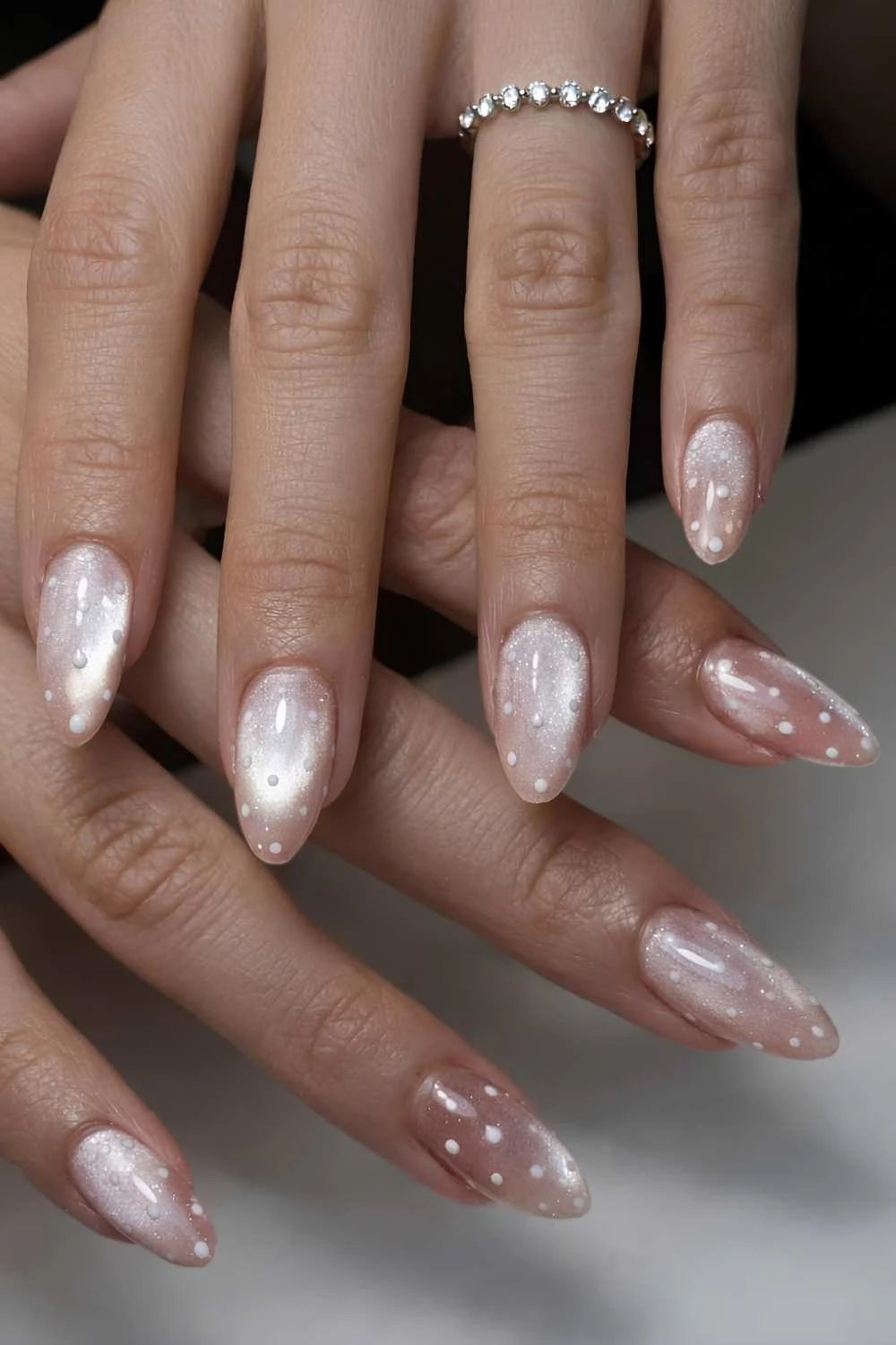 Neutral cat eye nails with polka dots