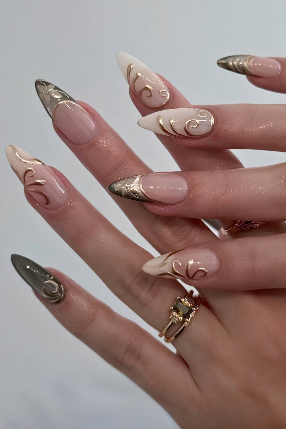 Neutral nails with gold chrome detailing