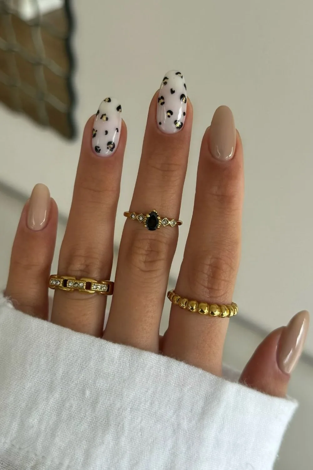 Neutral nails with leopard print accents