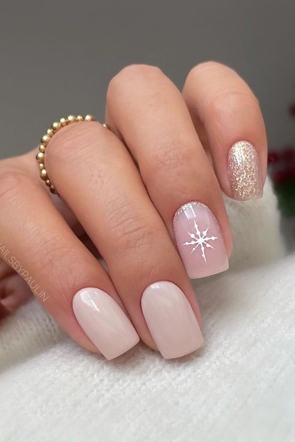 Neutral nails with snowflake and glitter accent