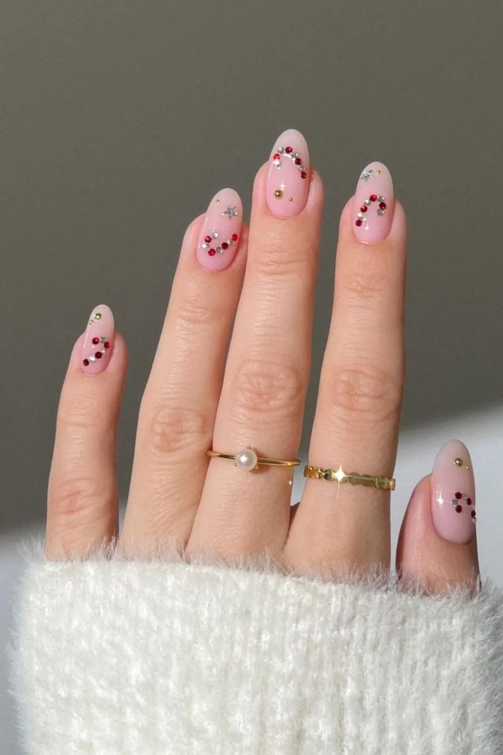 Nude nails with candy cane rhinestone details