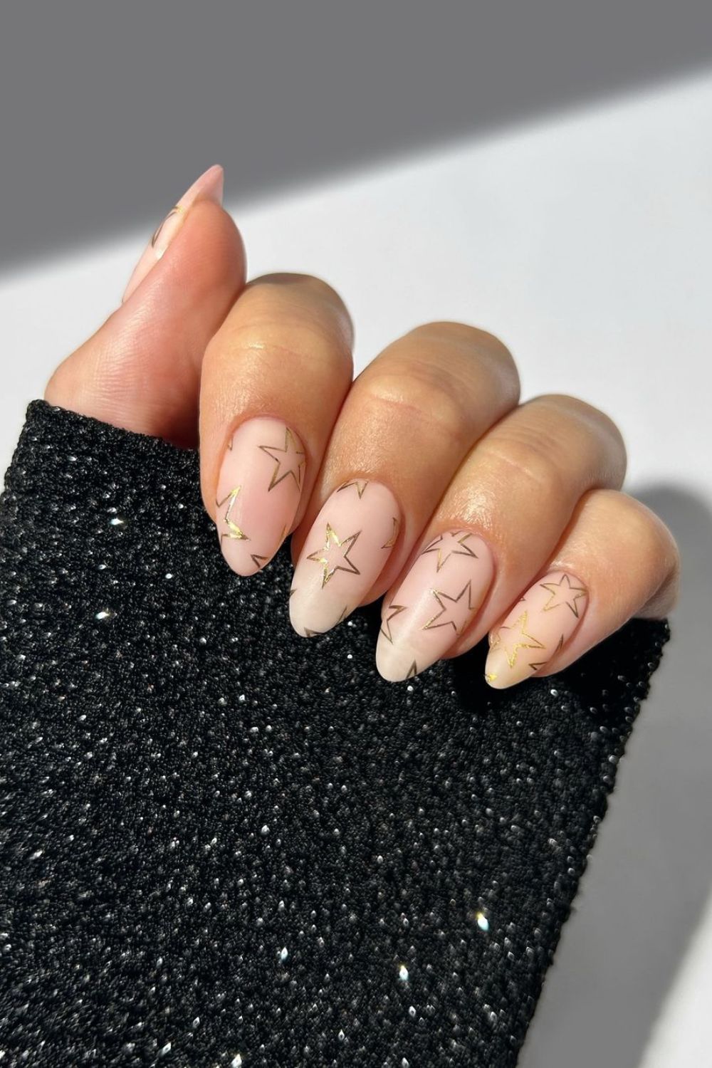 Nude nails with gold stars