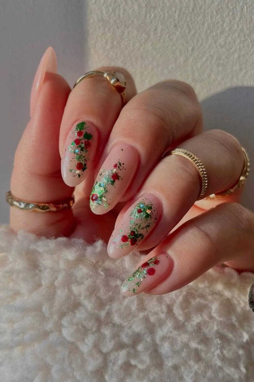 Nude nails with red and green glitters