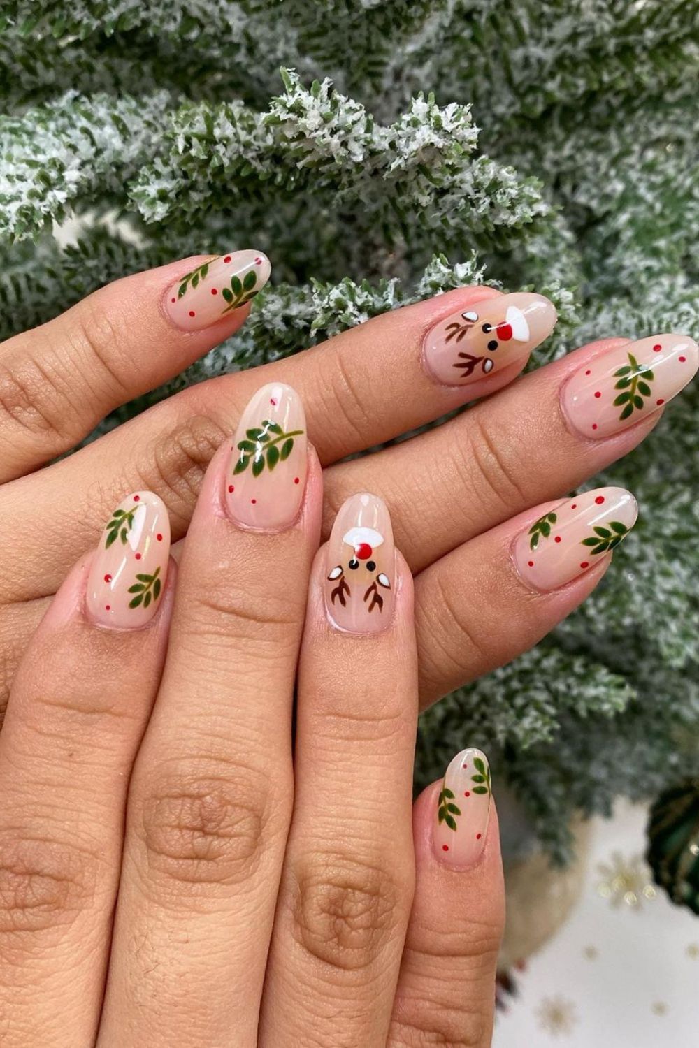 Nude nails with reindeer and holly berry accents